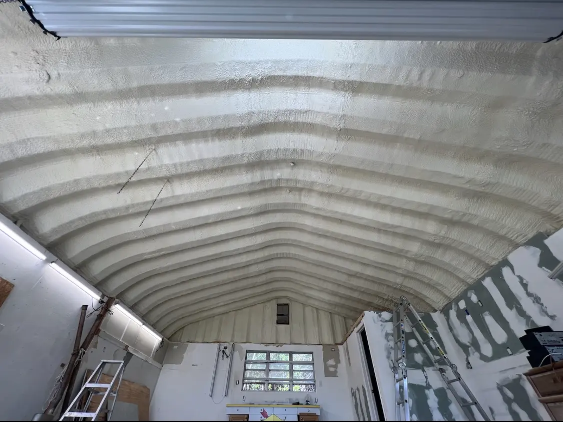 Spray polyurethane foam applied to the underside of a metal roof deck in Upland
